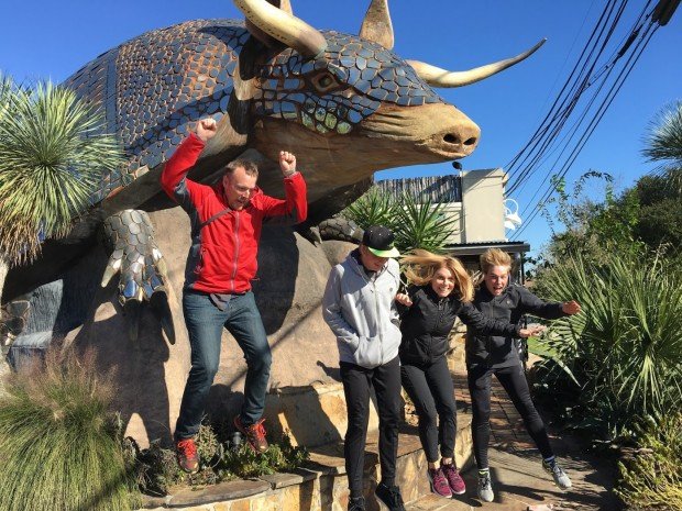 Jumping off of a giant metal armadillo at the Armadillo Palace, Houston, Texas